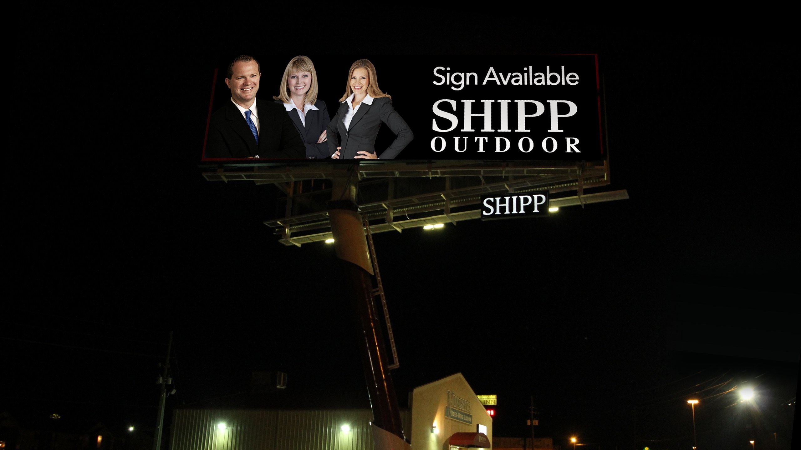 The Shipp family on their own Shipp Outdoor billboard at night